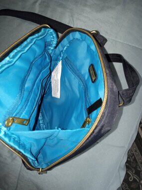 Travelon anti theft crossbody bag -like new interior cut resistant strap locking